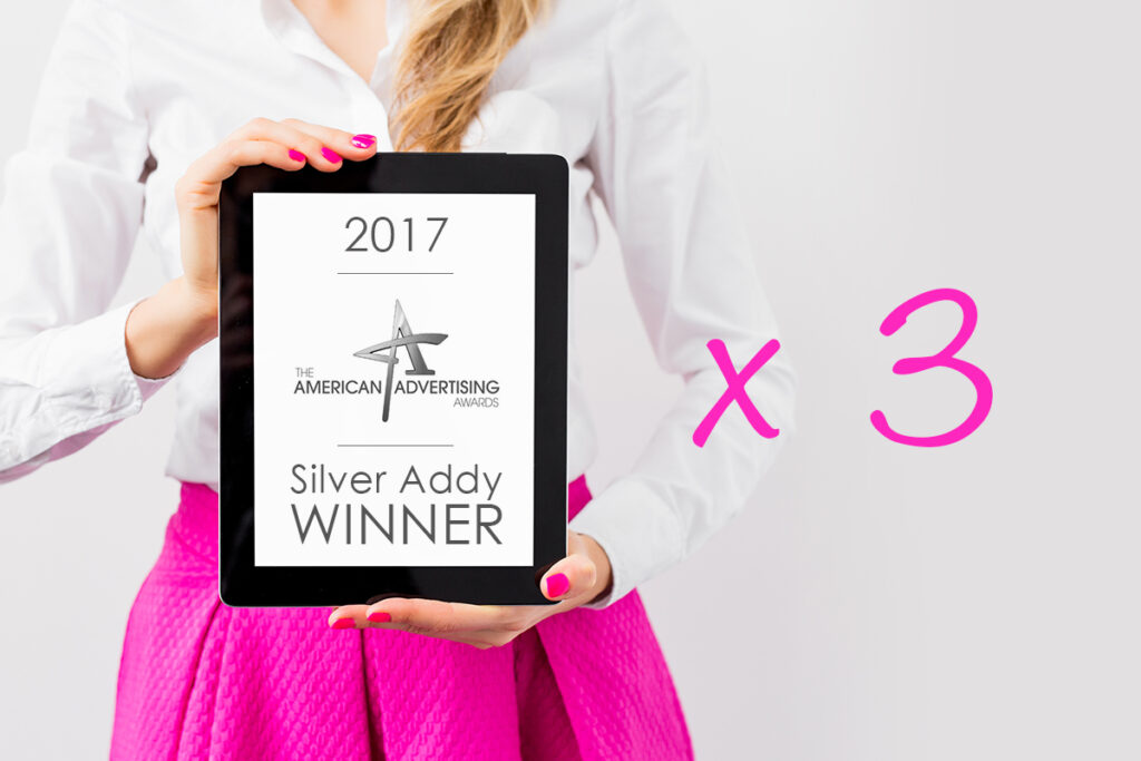 Madalina Iordache holding Silver Addy 2017 award