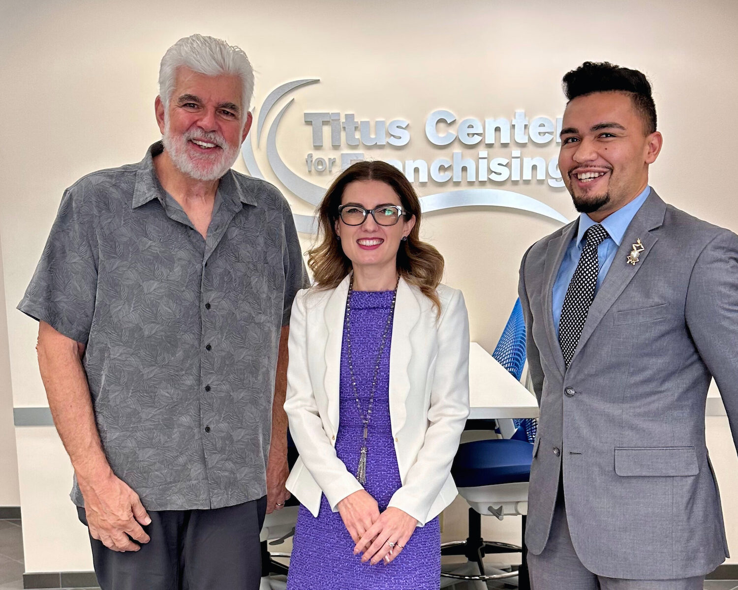 Bright Pink Agency's Madalina Iordache and Matt Cancino meeting with Dr. John Hayes, Director of the Titus Center for Franchising at Palm Beach Atlantic University.